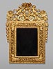 A rare and extremely fine quality Louis XIV carved giltwood mirror